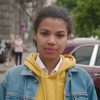 Portrait of Stylish African American Woman in Jean Jacket Standing at City Center